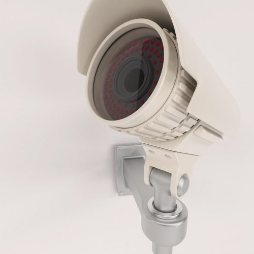 close-up-surveillance-camera-wall_1048-2436